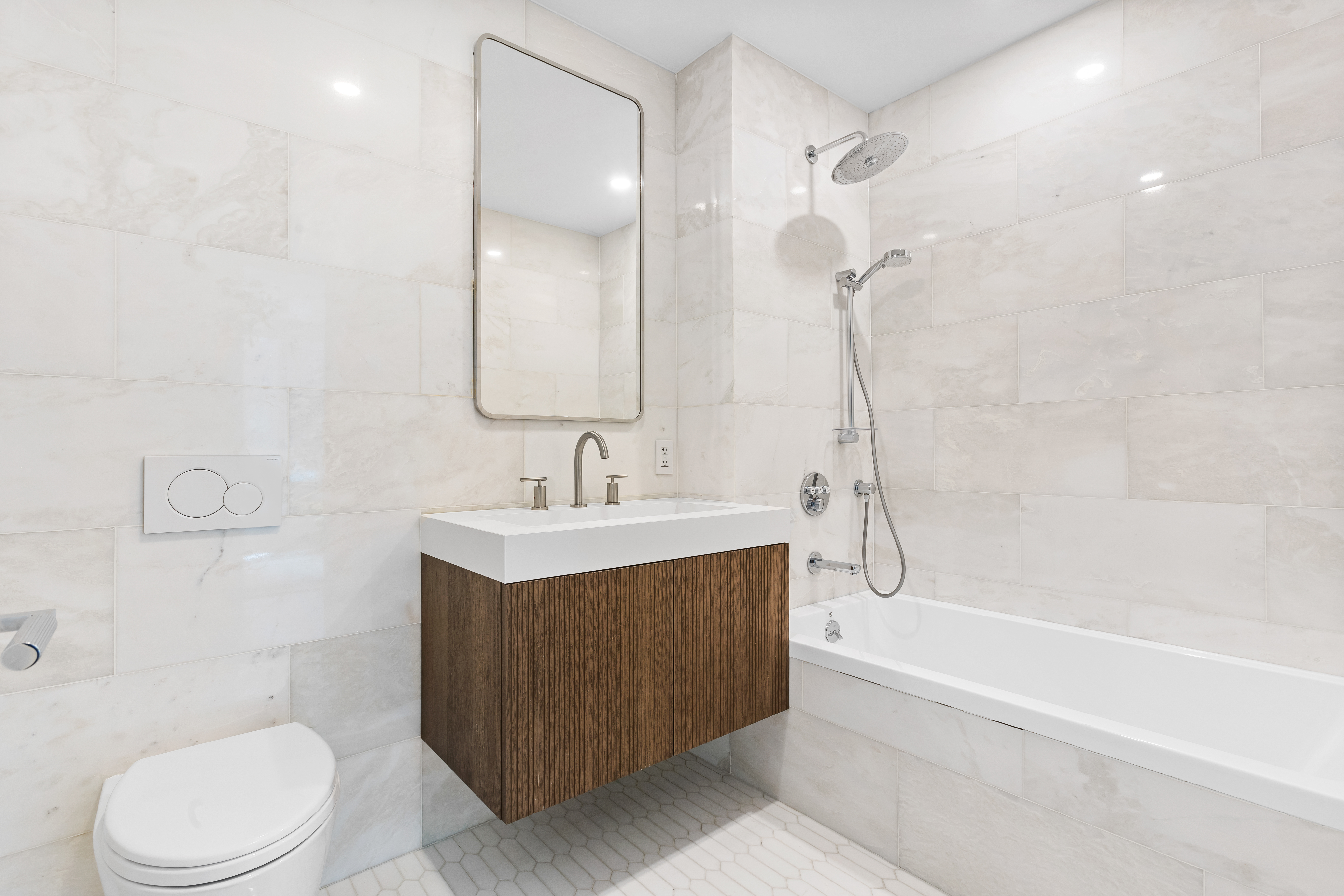 126 East 86th Street, Unit 5B Manhattan, NY 10028 - Photo 8 of 22 a bathroom with a sink mirror toilet and bathtub