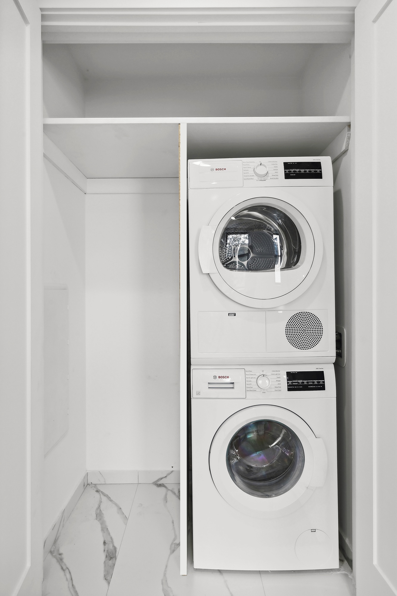 116 Madison Street, Unit 3F Brooklyn, NY 11216 - Photo 3 of 5 a utility room with dryer and washer