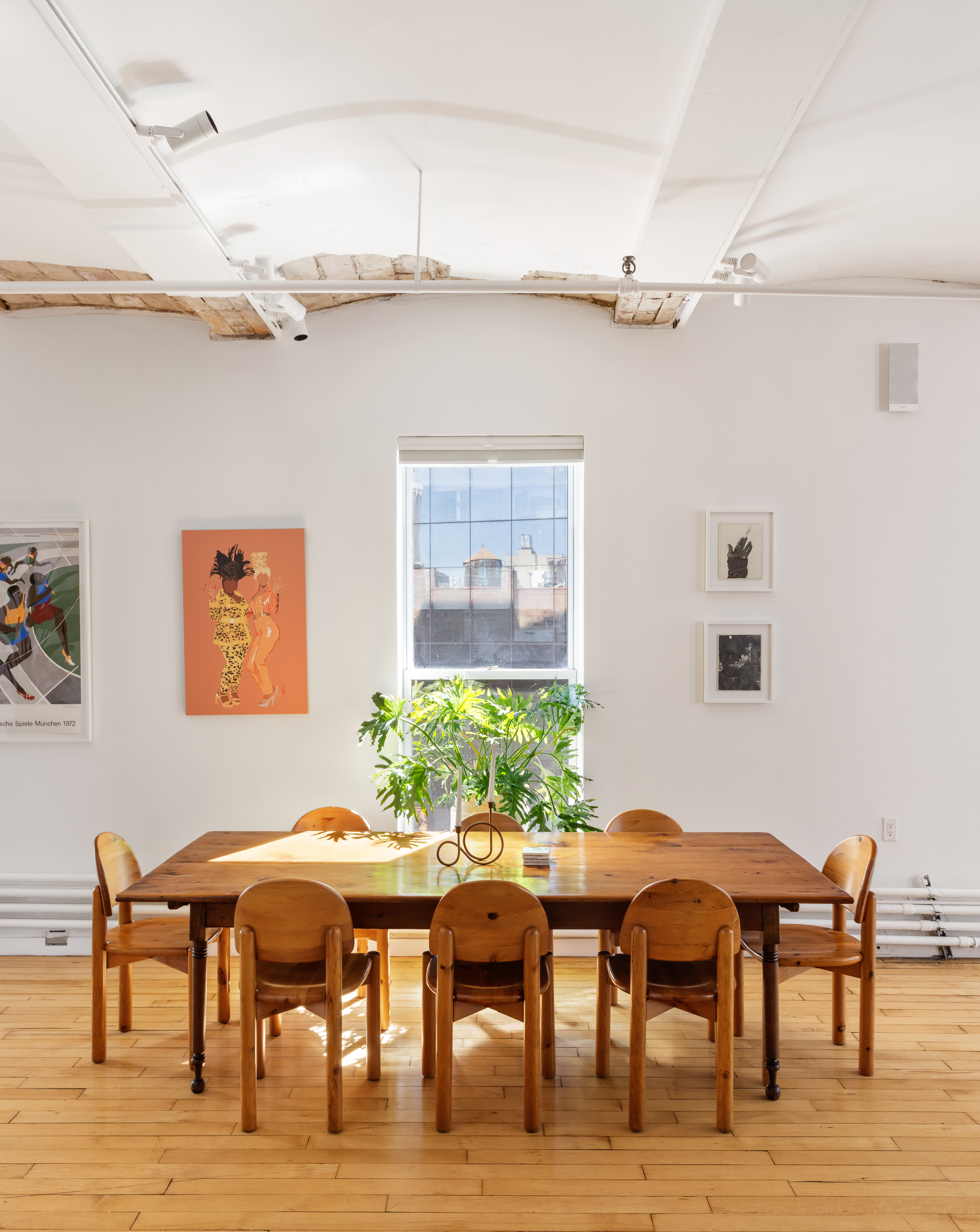 59 4th Avenue, Unit 8A Manhattan, NY 10003 - Photo 7 of 12 a view of a dining room with furniture and wooden floor