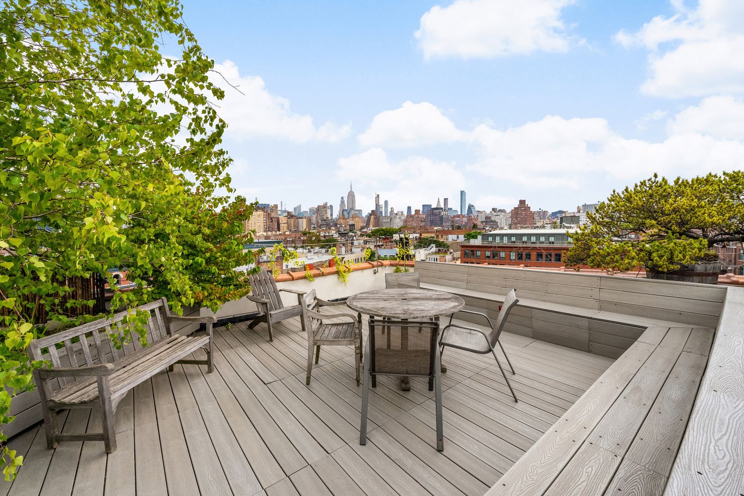 a view of roof deck with patio