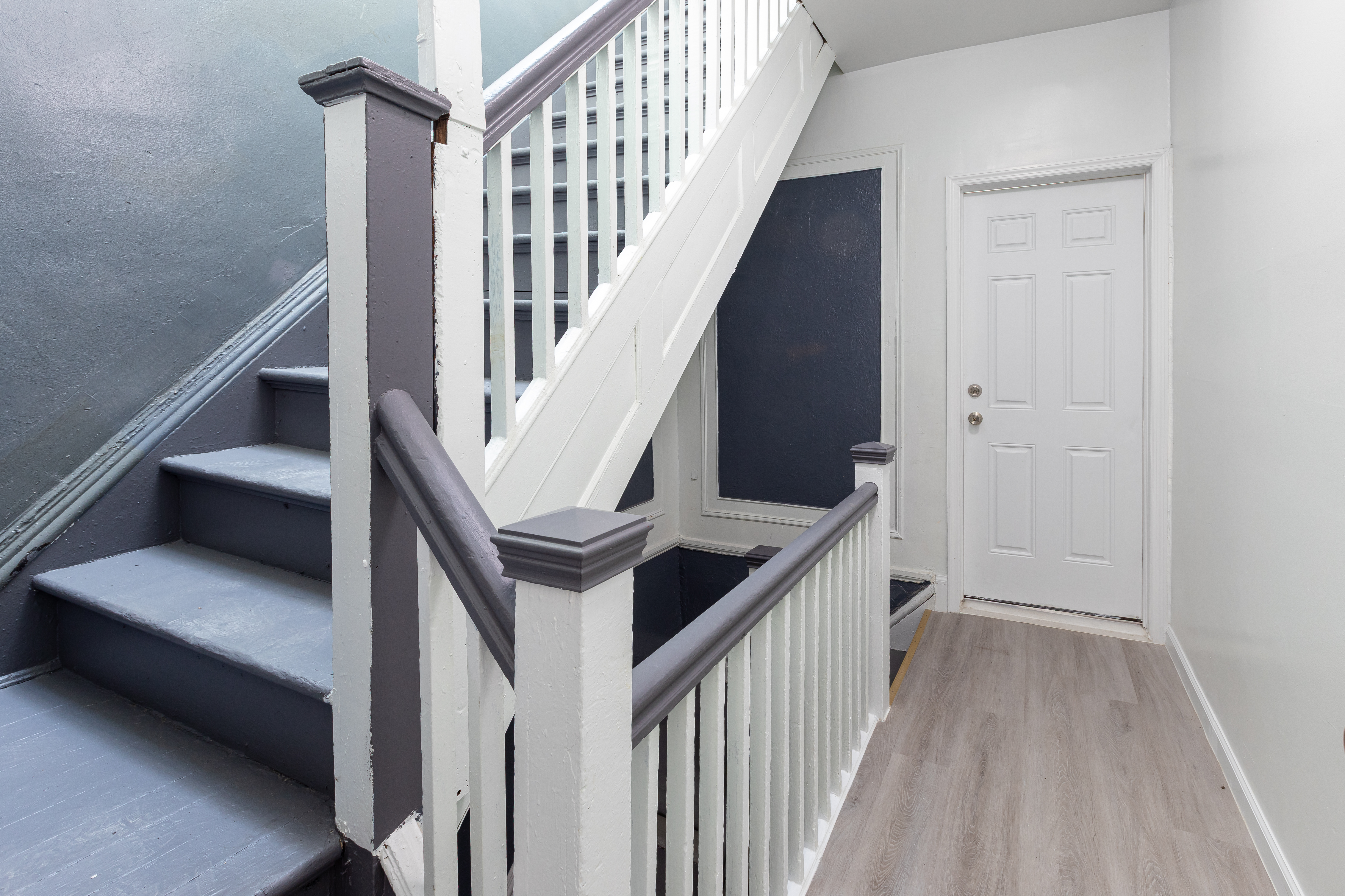 1030 Winthrop Street, Unit 2A Brooklyn, NY 11212 - Photo 8 of 10 a view of staircase with lots of frames on wall and wooden floor