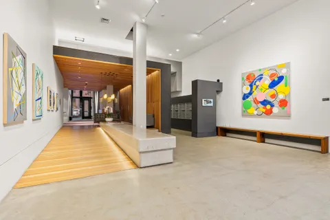 a view of a balcony with chairs and couch