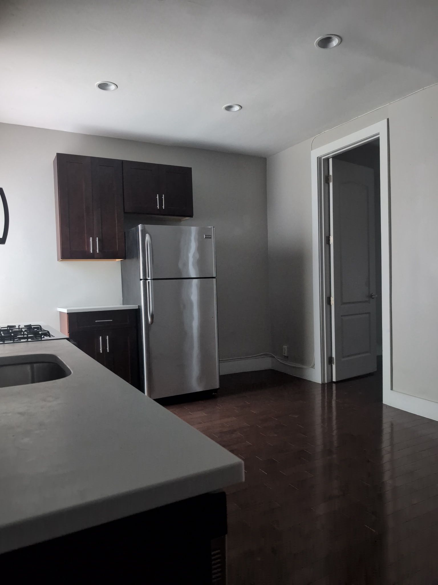 2405 Nostrand Avenue, Unit 6 Brooklyn, NY 11210 - Photo 2 of 11 a kitchen with a refrigerator and a stove top oven