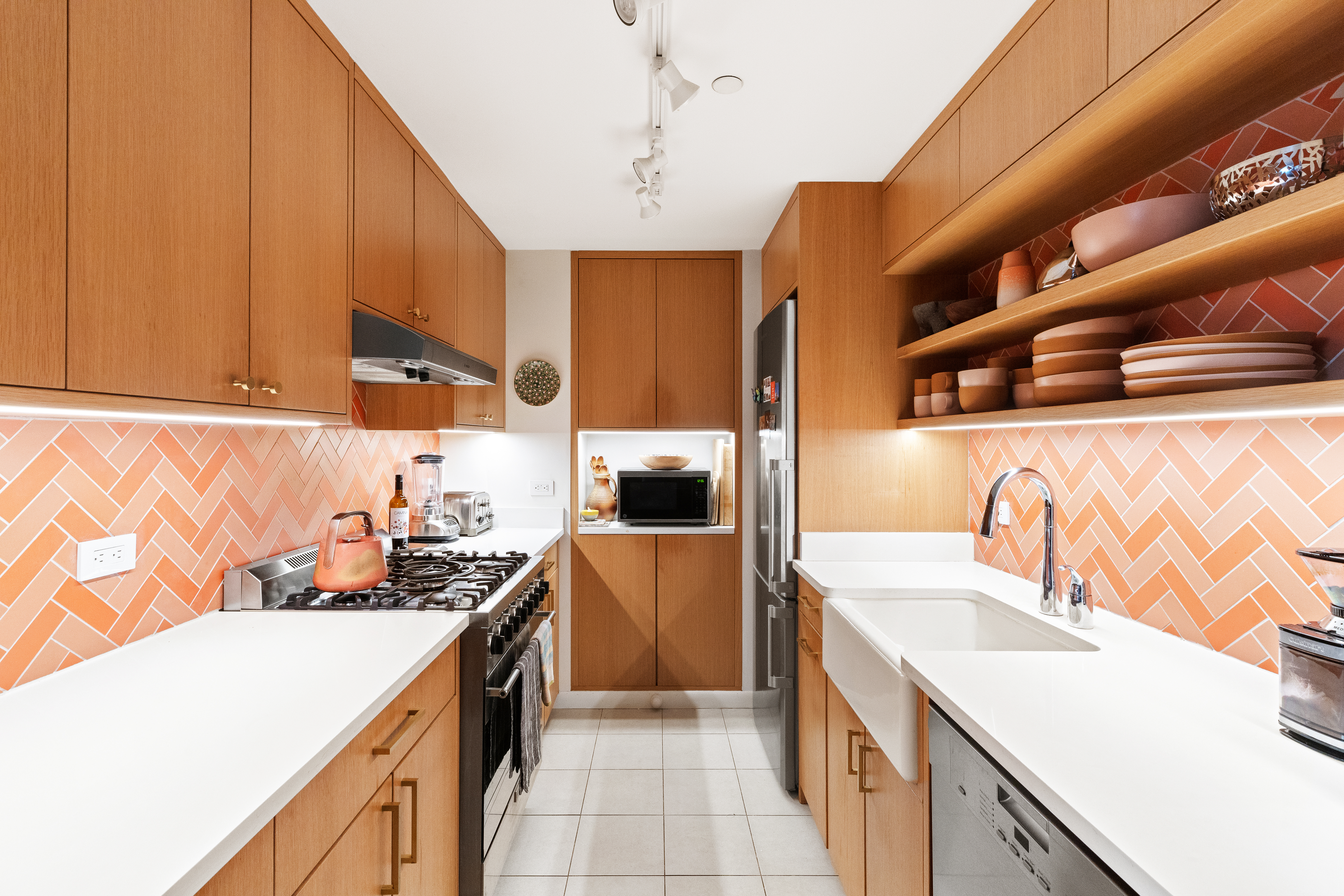 736 West 187th Street, Unit 303 Manhattan, NY 10033 - Photo 3 of 16 a kitchen with stainless steel appliances a sink a stove and a refrigerator