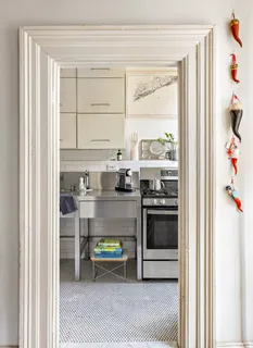 a kitchen with stainless steel appliances granite countertop a stove and a refrigerator