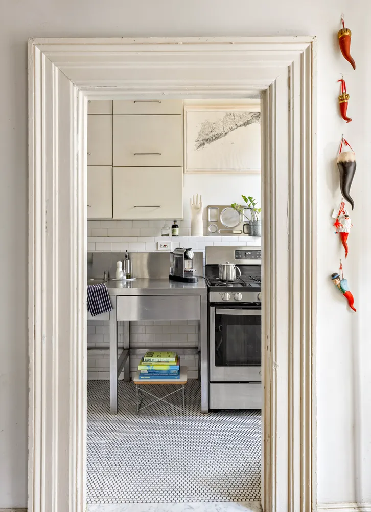 a kitchen with stainless steel appliances granite countertop a stove and a refrigerator