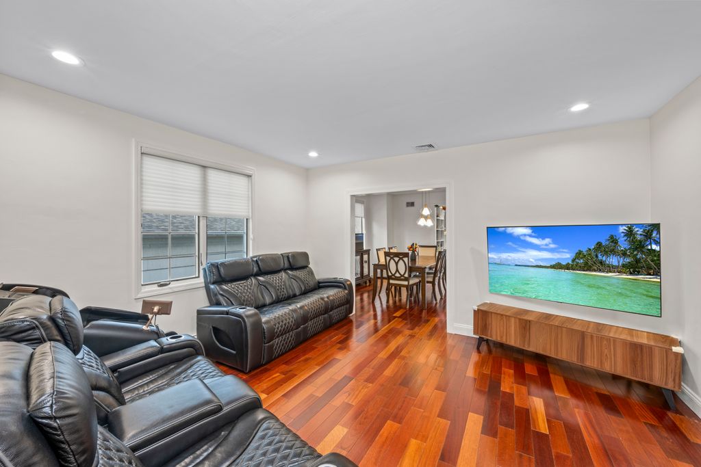 79 Sparkill Avenue Staten Island, NY 10304 - Photo 5 of 32 a living room with furniture and a flat screen tv