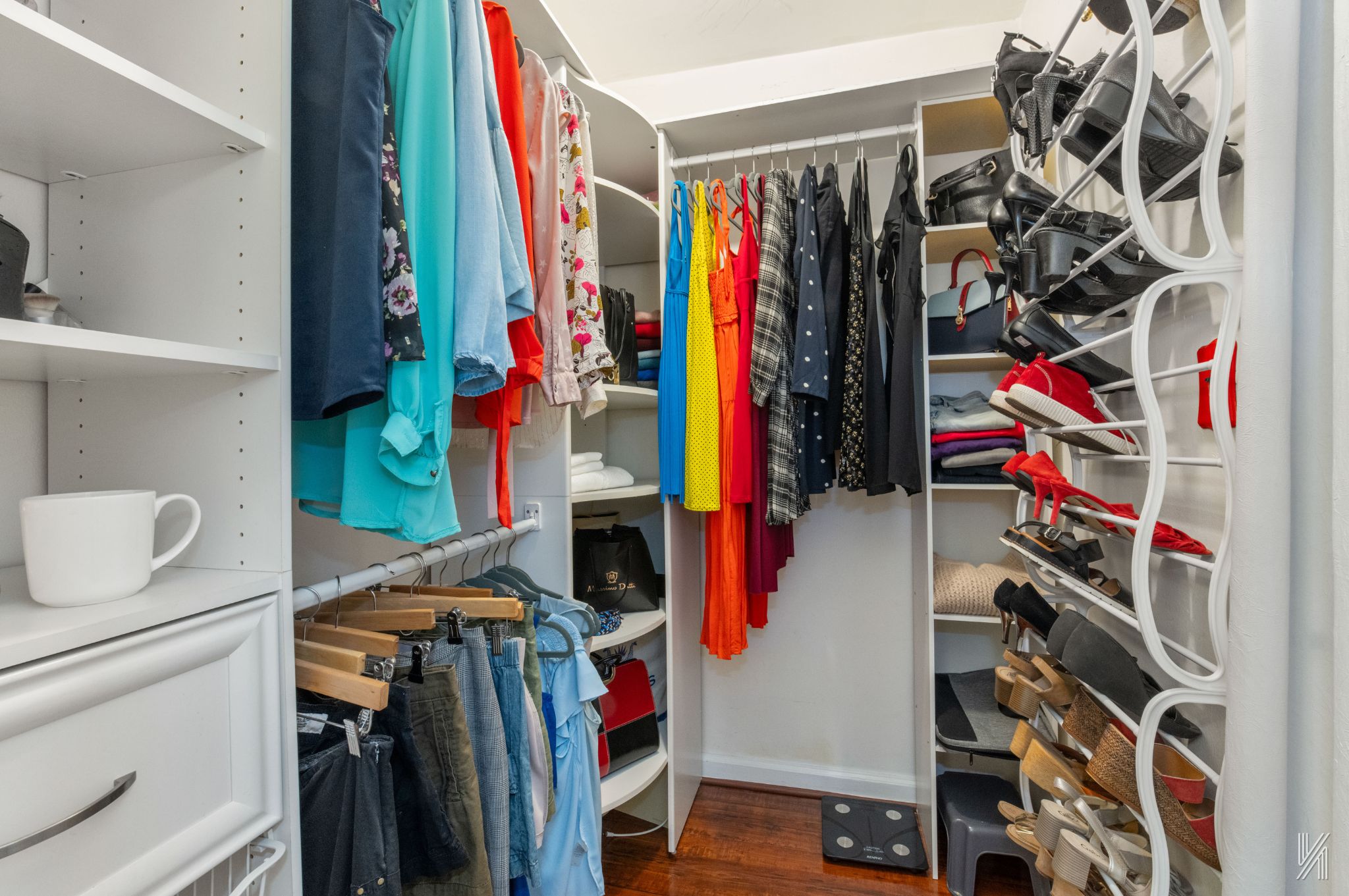 39-30 52nd Street, Unit 5E Queens, NY 11377 - Photo 11 of 15 a view of walk in closet with clothes and shoes