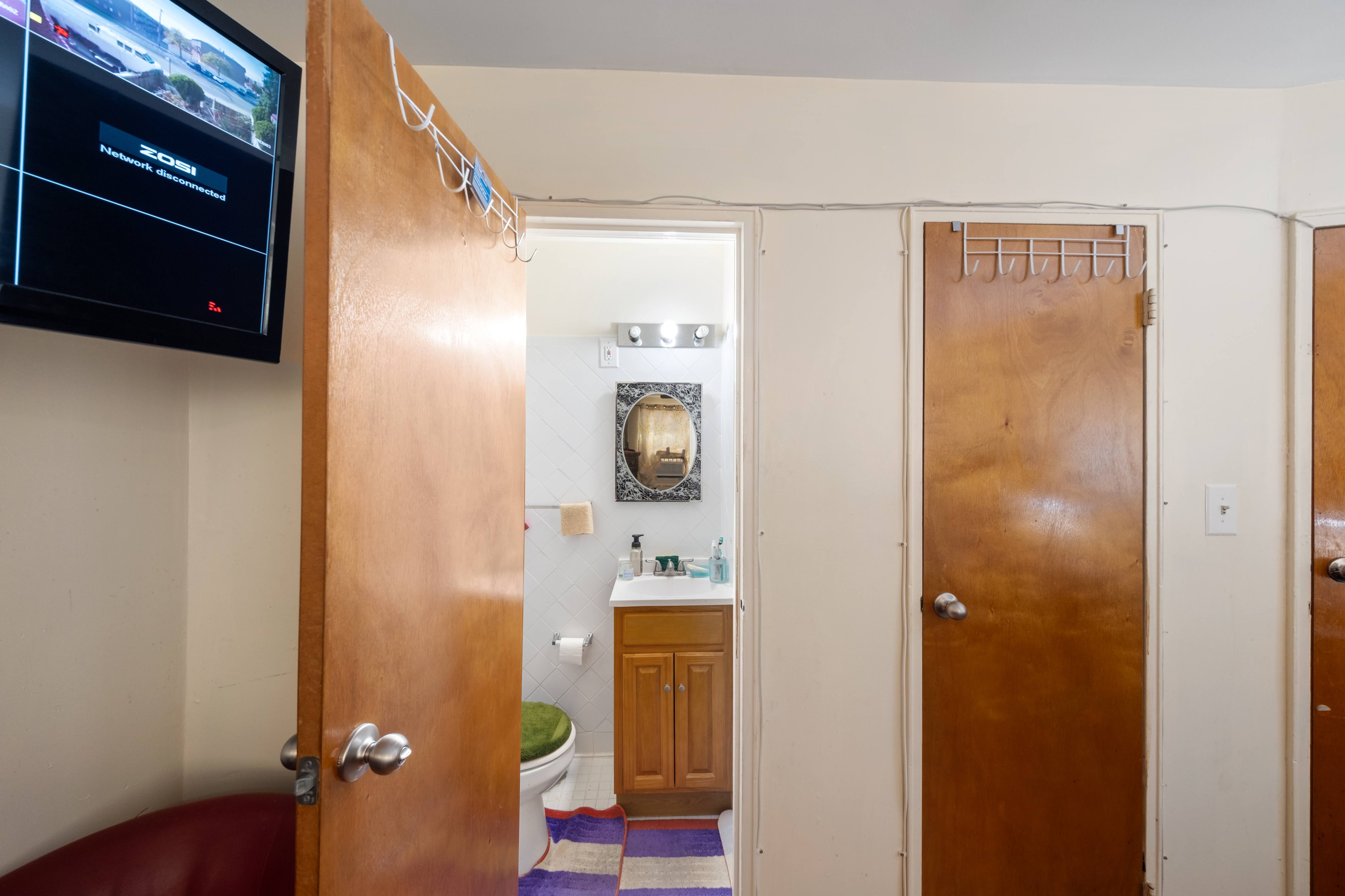 1464 East 84th Street Brooklyn, NY 11236 - Photo 18 of 22 a bathroom with a mirror