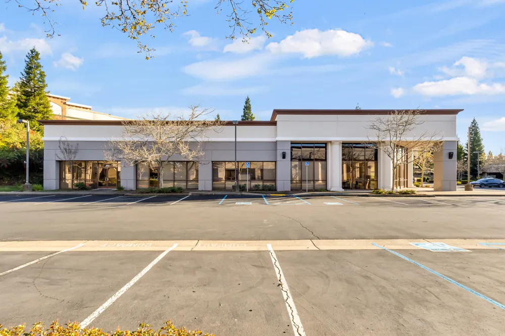 a front view of a building with a street