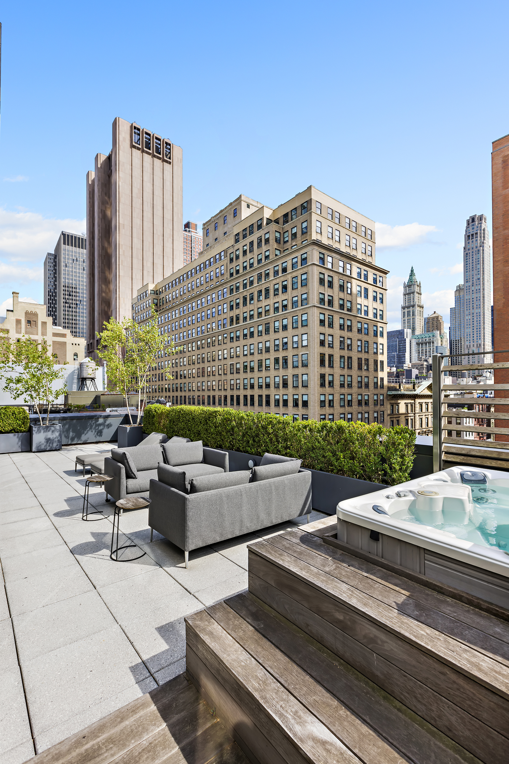 34 Leonard Street, Unit PH Manhattan, NY 10013 - Photo 21 of 30 a view of a roof deck with couches and potted plants
