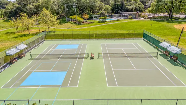 a view of swimming pool with seating area