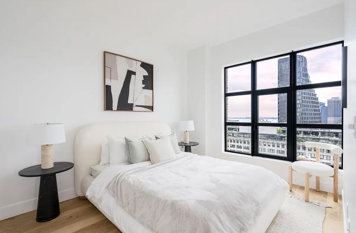 69 Adams Street, Unit 20A Brooklyn, NY 11201 - Photo 4 of 14 a bedroom with a bed and a large window