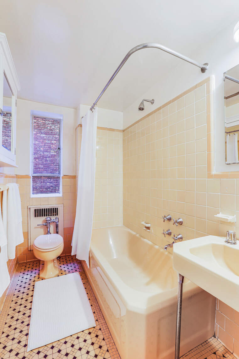 565 West End Avenue, Unit 3C Manhattan, NY 10024 - Photo 11 of 15 a bathroom with a sink toilet a mirror and shower