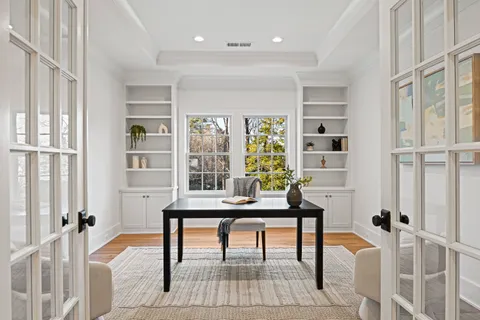 a workspace with furniture and a window