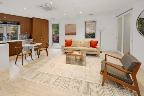 a living room with furniture and a table