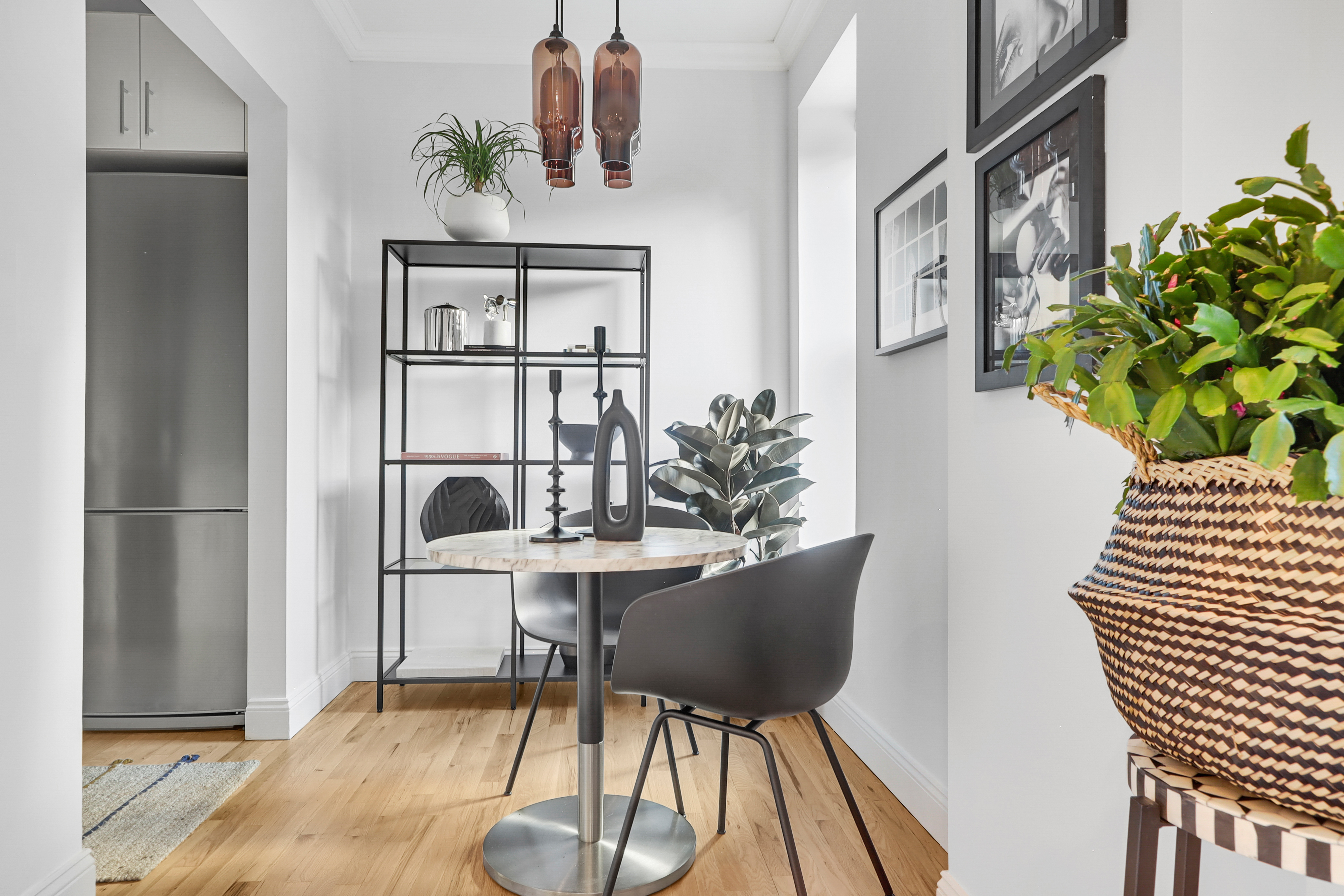 250 West 103rd Street, Unit 4A Manhattan, NY 10025 - Photo 5 of 14 a view of a dining room with furniture and a potted plant