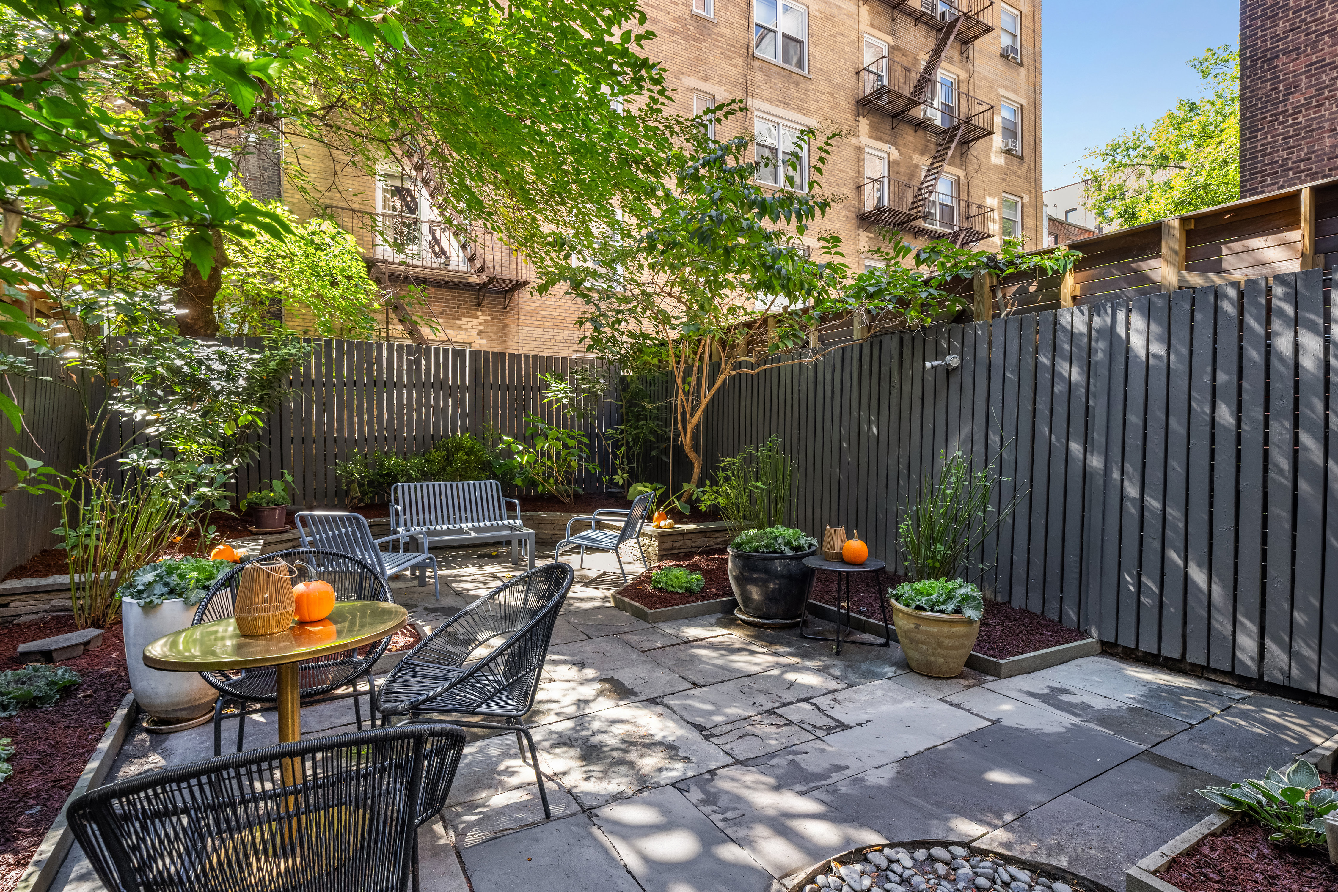 112 West 13th Street Manhattan, NY 10011 - Photo 18 of 46 a view of backyard with outdoor seating a patio and plants