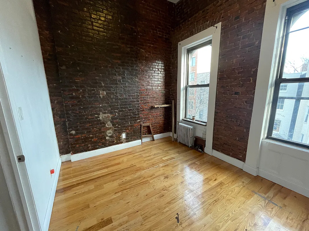 199 Java Street Brooklyn, NY 11222 - Photo 31 of 32 a view of an empty room with a window