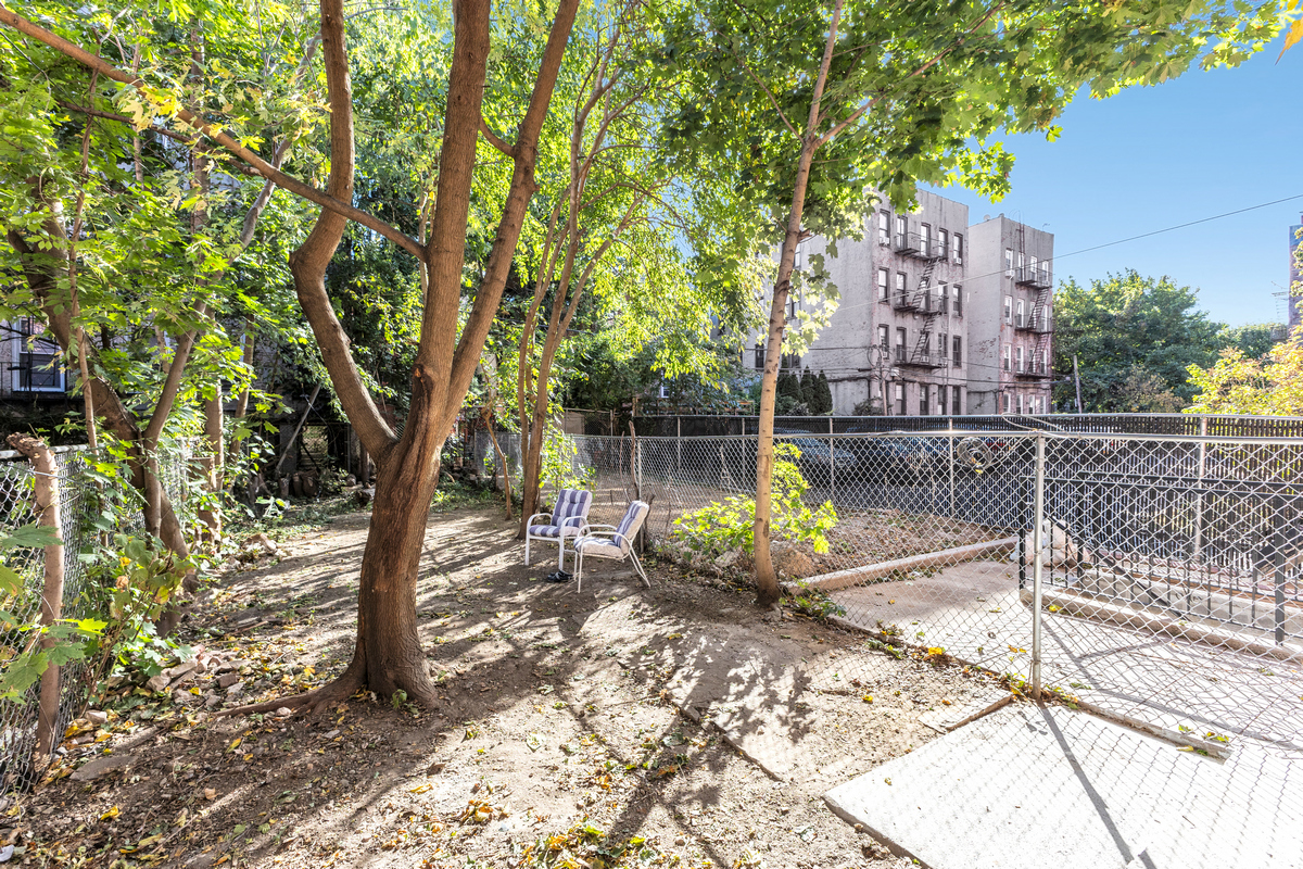 574 Gates Avenue Brooklyn, NY 11221 - Photo 14 of 16 a view of a bench in a backyard