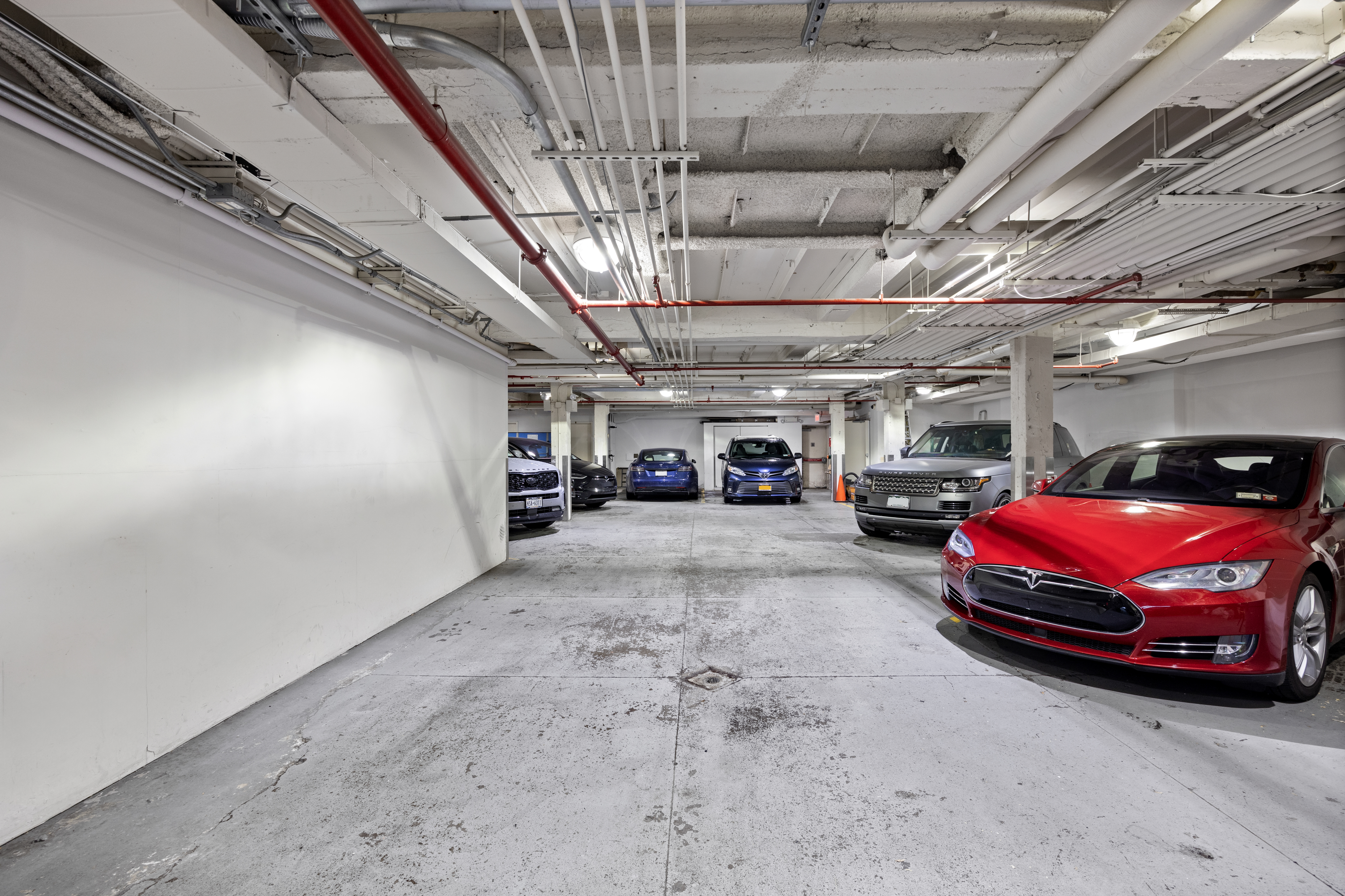 219 East 67th Street, Unit 5 Manhattan, NY 10065 - Photo 17 of 18 a view of parking garage with cars