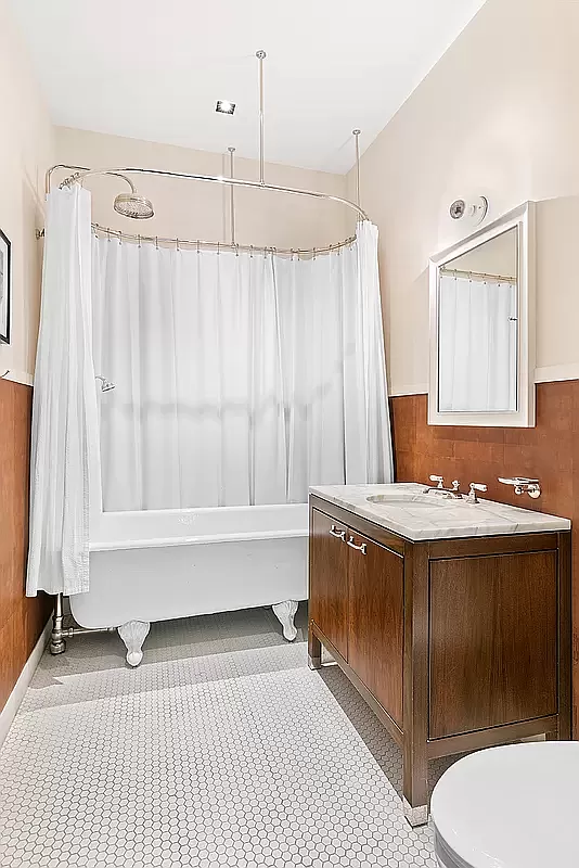20 Greene Street, Unit 4B Manhattan, NY 10013 - Photo 11 of 13 a bathroom with a sink a toilet and bathtub