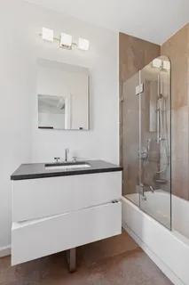 a bedroom with bed and window