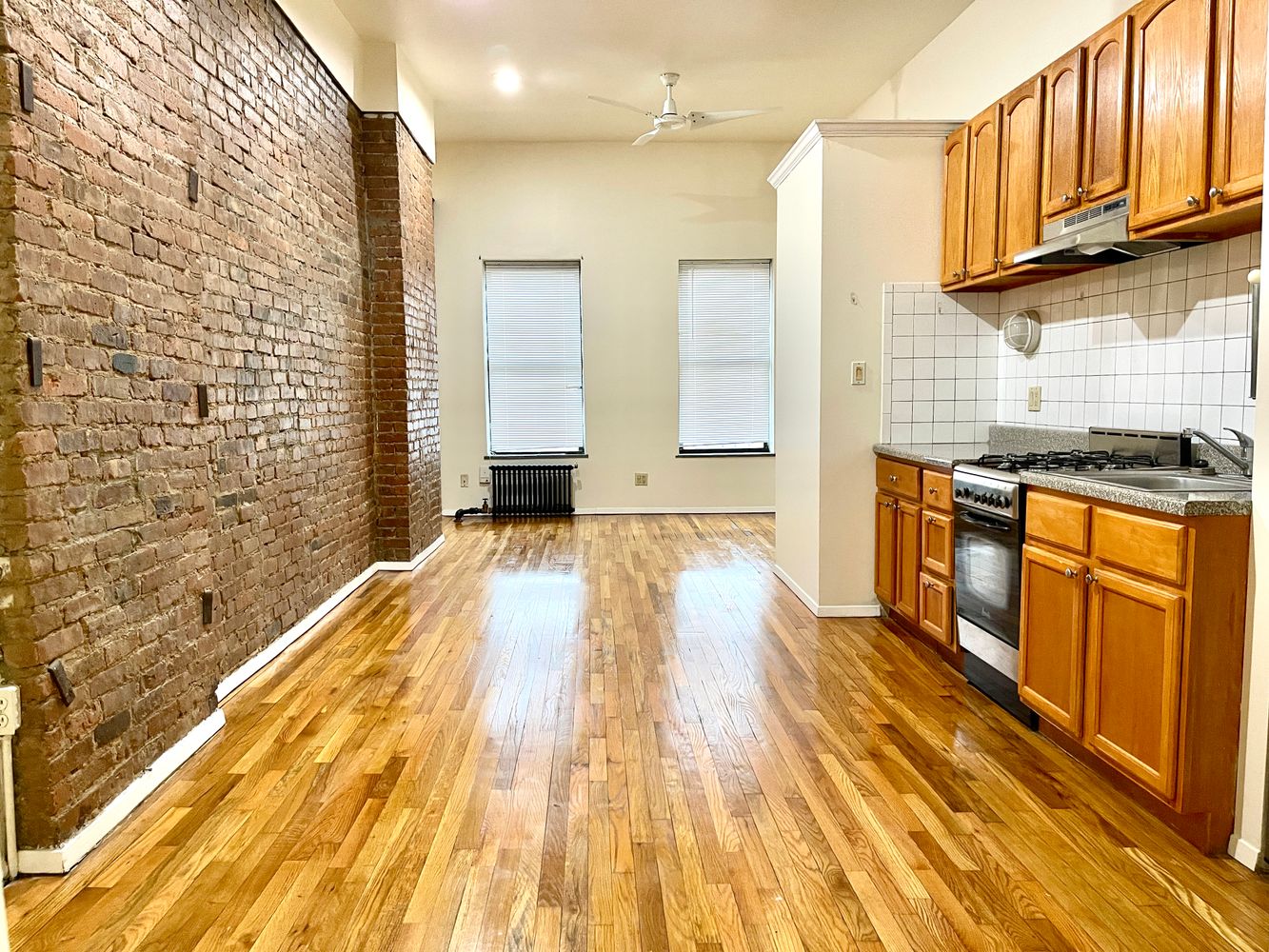 1672 Park Avenue Manhattan, NY 10035 - Photo 5 of 35 a spacious bathroom with a granite countertop tub sink and wooden floor