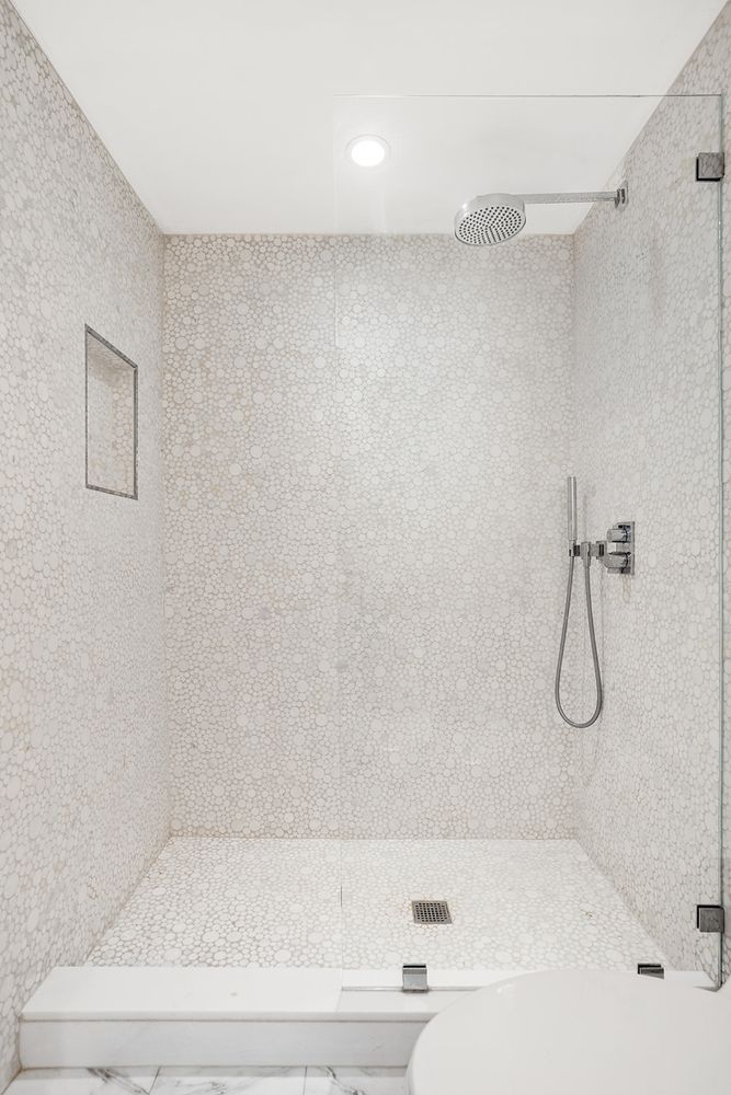 125 East 12th Street, Unit 1E Manhattan, NY 10003 - Photo 14 of 16 a bathroom with a bathtub