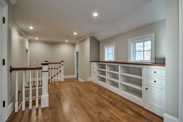 185 Dedham Street Dover, MA 02030 - Photo 10 of 32 a view of a hallway with wooden floor and windows