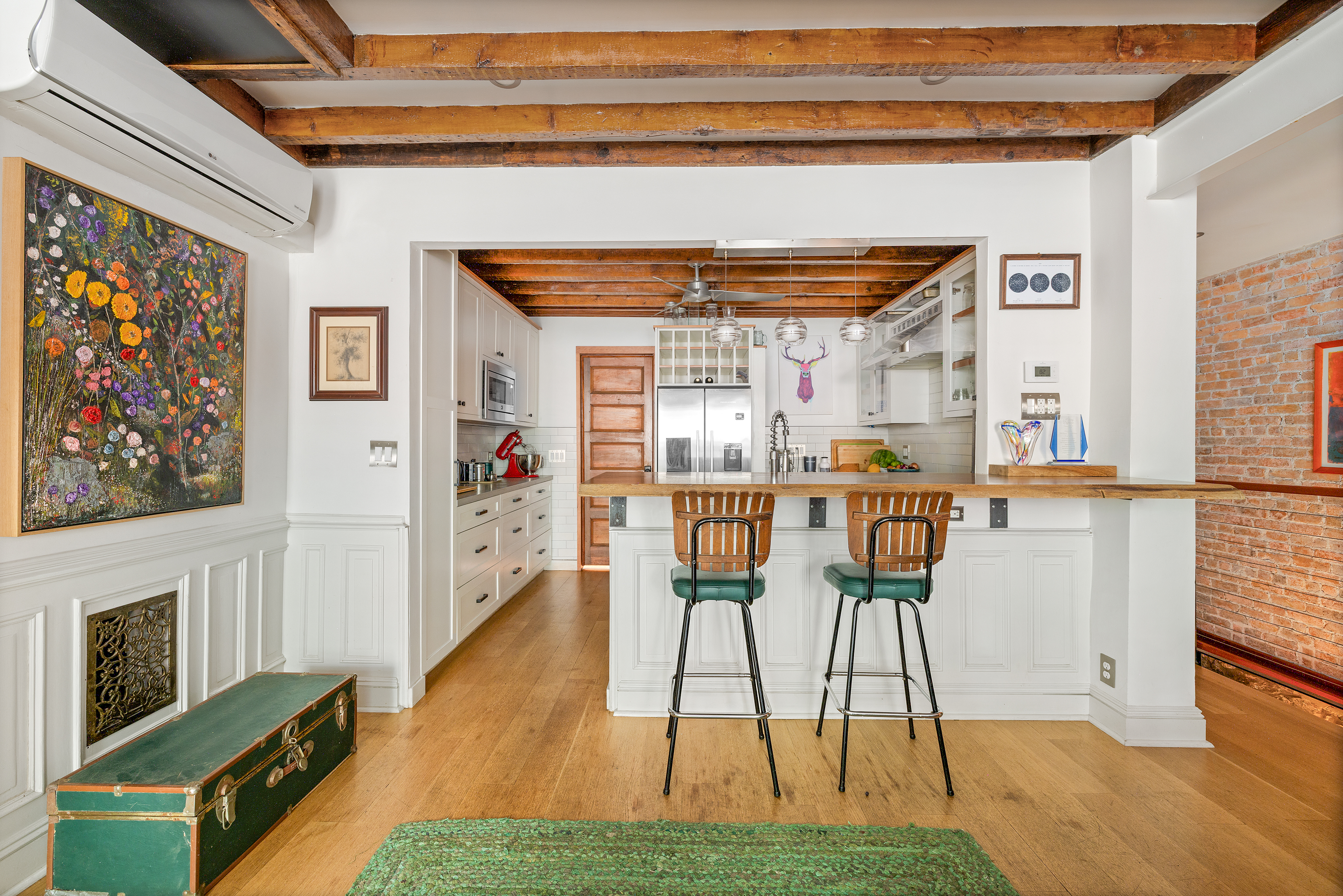 445 Greene Avenue, Unit 1 Brooklyn, NY 11216 - Photo 2 of 12 a living room with furniture a fireplace and a flat screen tv