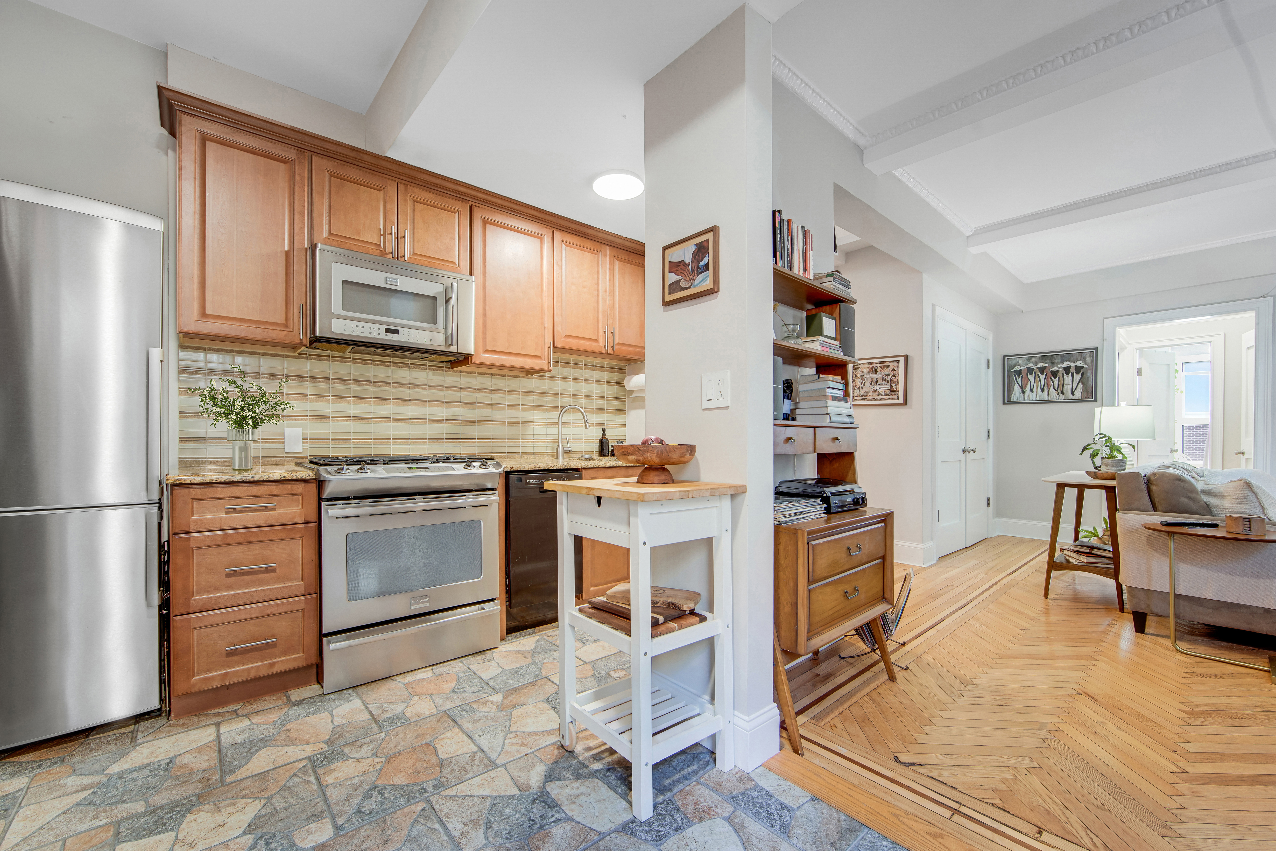 165 West 91st Street, Unit 15B Manhattan, NY 10024 - Photo 4 of 24 a kitchen with stainless steel appliances granite countertop a refrigerator and stove top oven
