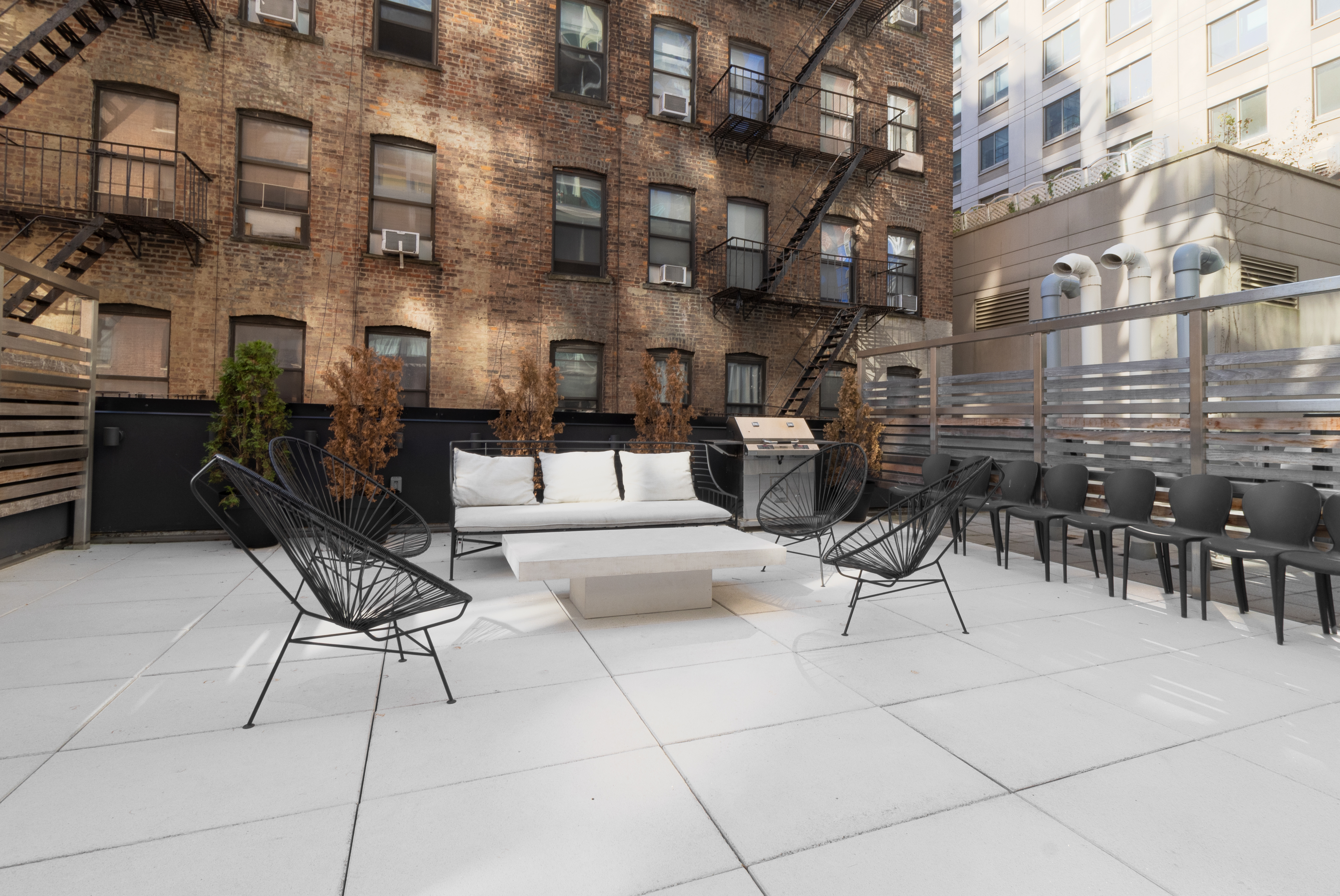 302 East 96th Street, Unit 1103 Manhattan, NY 10128 - Photo 18 of 22 a outdoor space with lots of tables and chairs