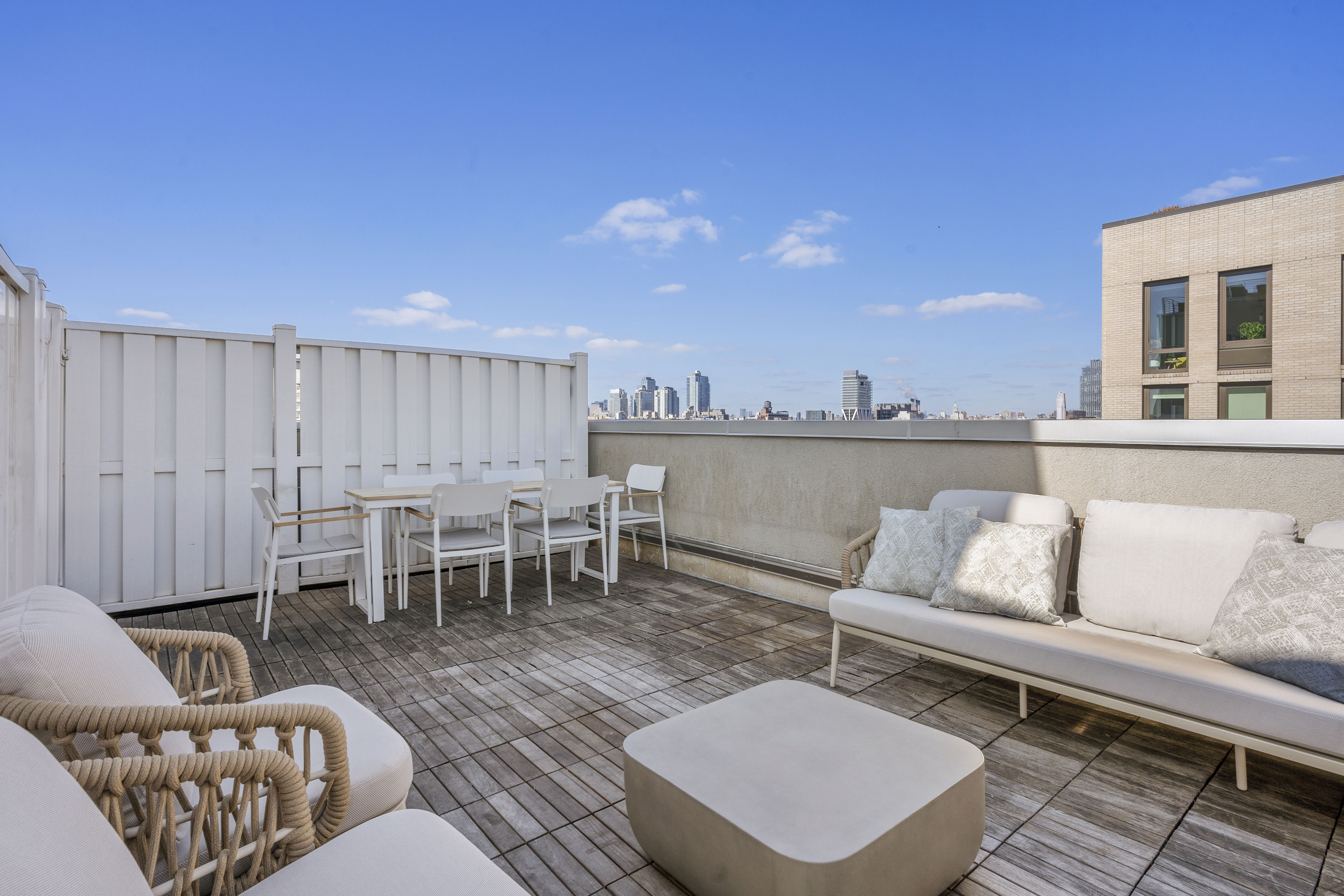 460 Manhattan Avenue, Unit PHB Brooklyn, NY 11222 - Photo 13 of 16 a living room with furniture and a table