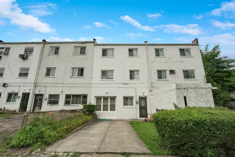 front view of a large building with a yard