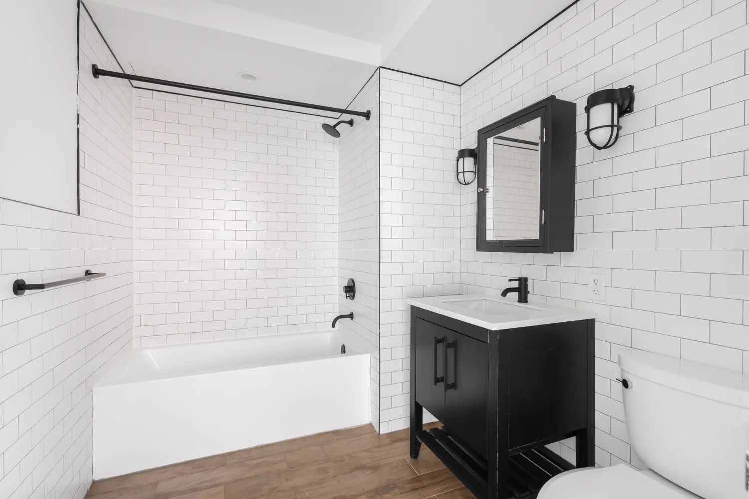 a bathroom with a toilet sink and bathtub