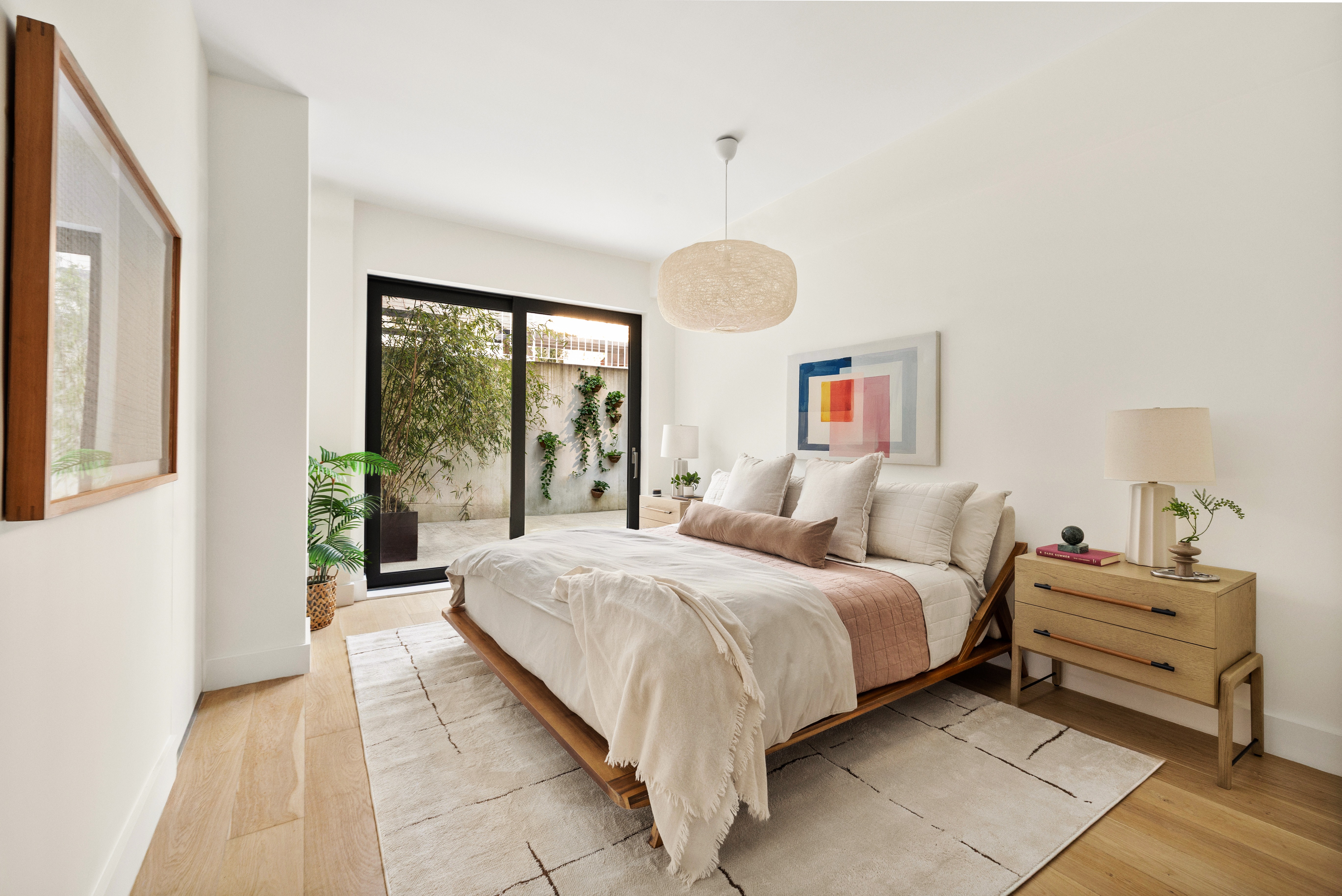 225 14th Street, Unit GARDEN A Brooklyn, NY 11215 - Photo 5 of 13 a bedroom with a large bed and a large window