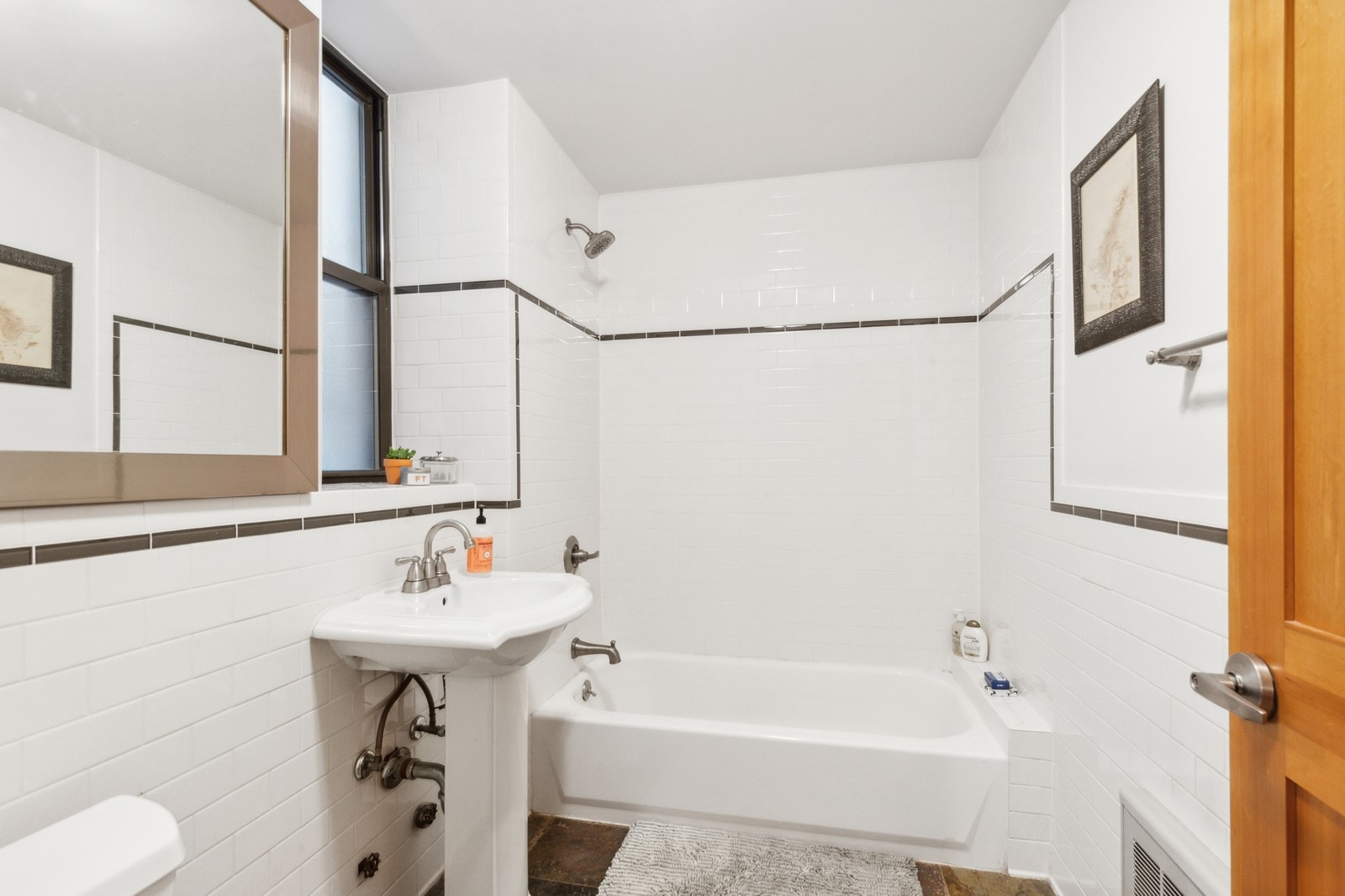 250 Manhattan Avenue, Unit 3A Manhattan, NY 10026 - Photo 10 of 15 a bathroom with a sink and a bathtub