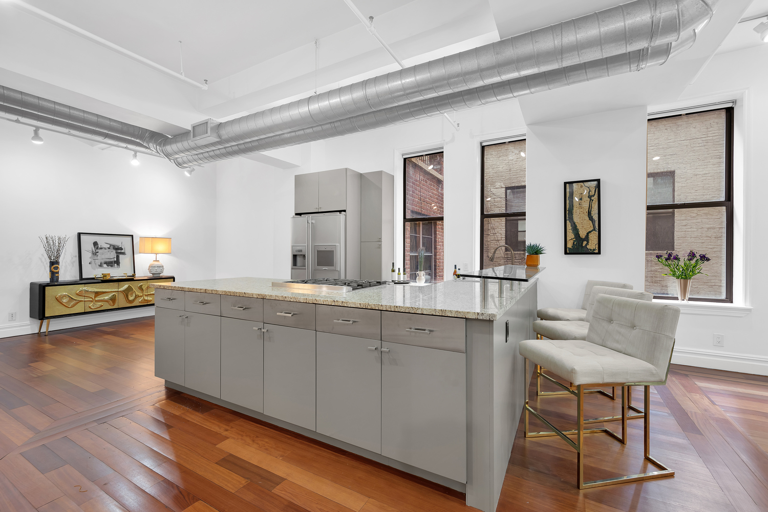 43-45 East 30th Street, Unit 4C Manhattan, NY 10016 - Photo 1 of 12 a spacious bathroom with a granite countertop sink and a mirror