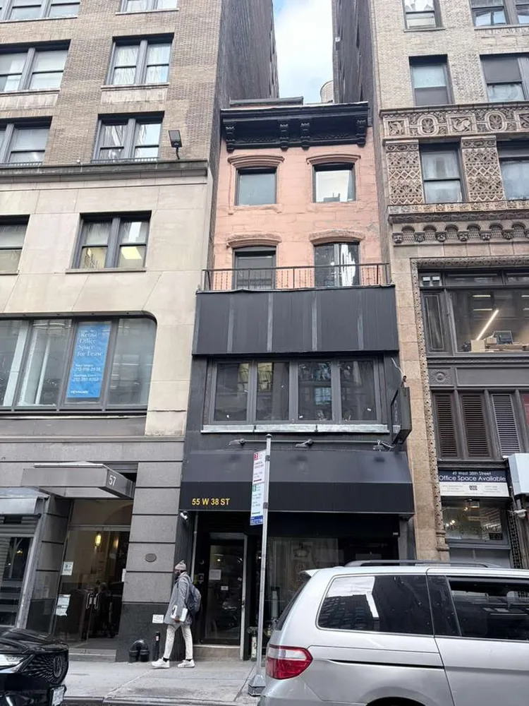 a view of a car park in front of building
