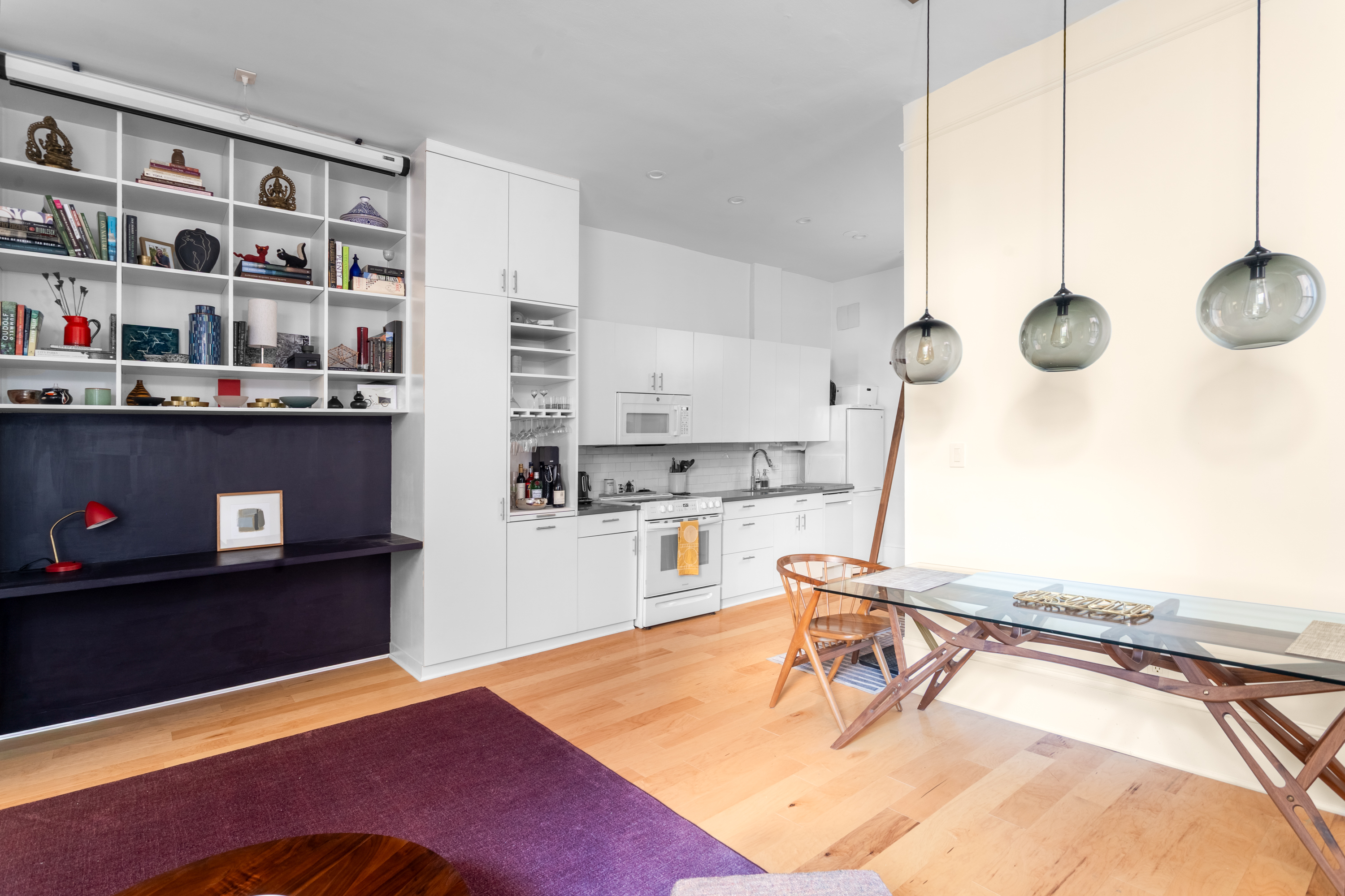 292 Riverside Drive, Unit 3C Manhattan, NY 10025 - Photo 3 of 9 a living room with furniture a flat screen tv and a stove