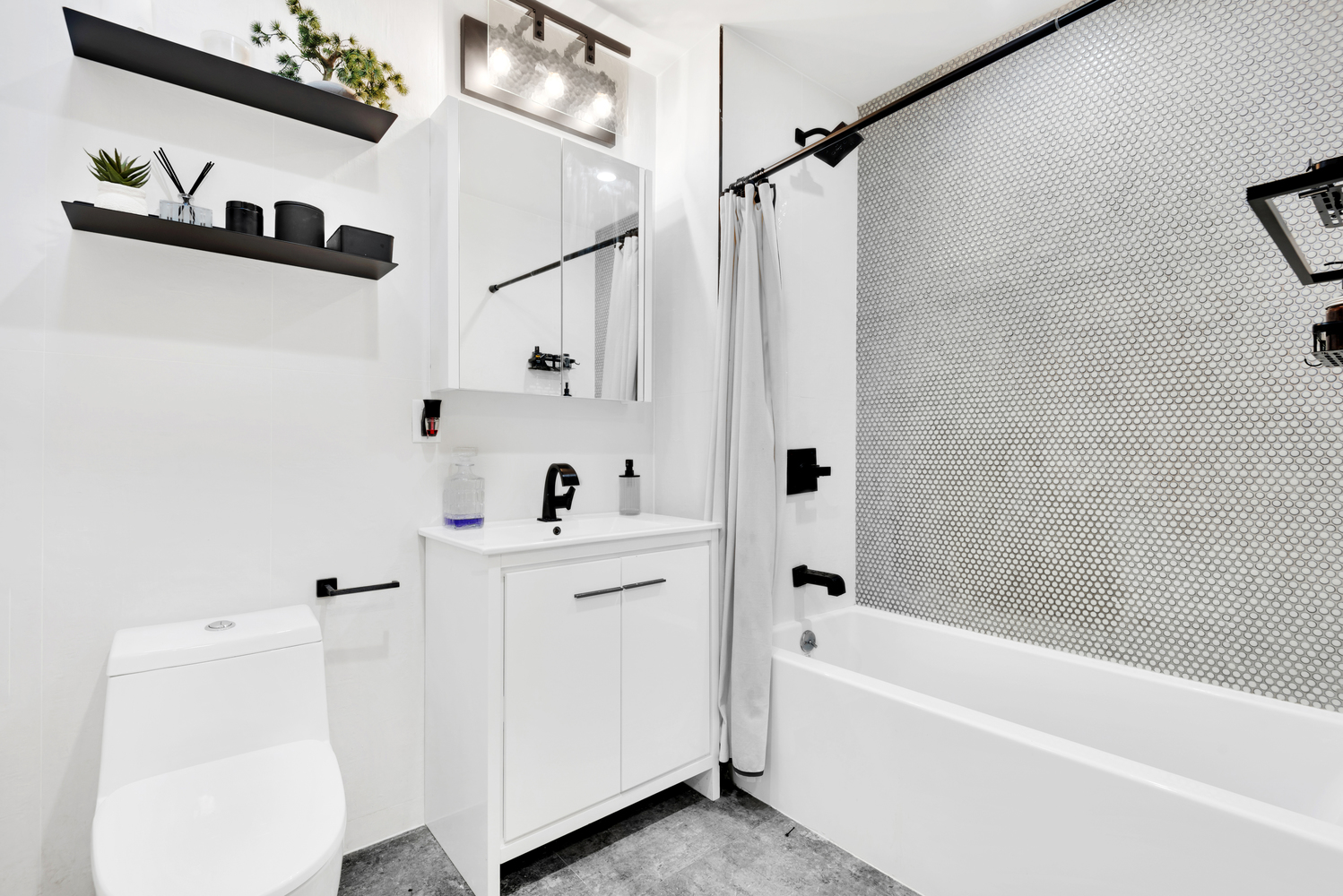 1325 Herkimer Street, Unit 404 Brooklyn, NY 11233 - Photo 5 of 7 a bathroom with a bathtub a shower a sink and a window