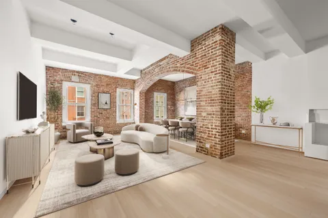 a large room with lots of furniture and windows