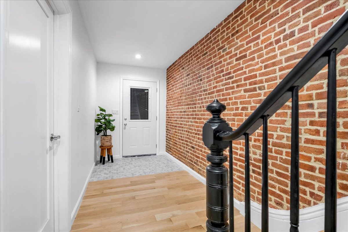 448 Halsey Street, Unit 1 Brooklyn, NY 11233 - Photo 13 of 22 a view of entryway with wooden floor and stairs