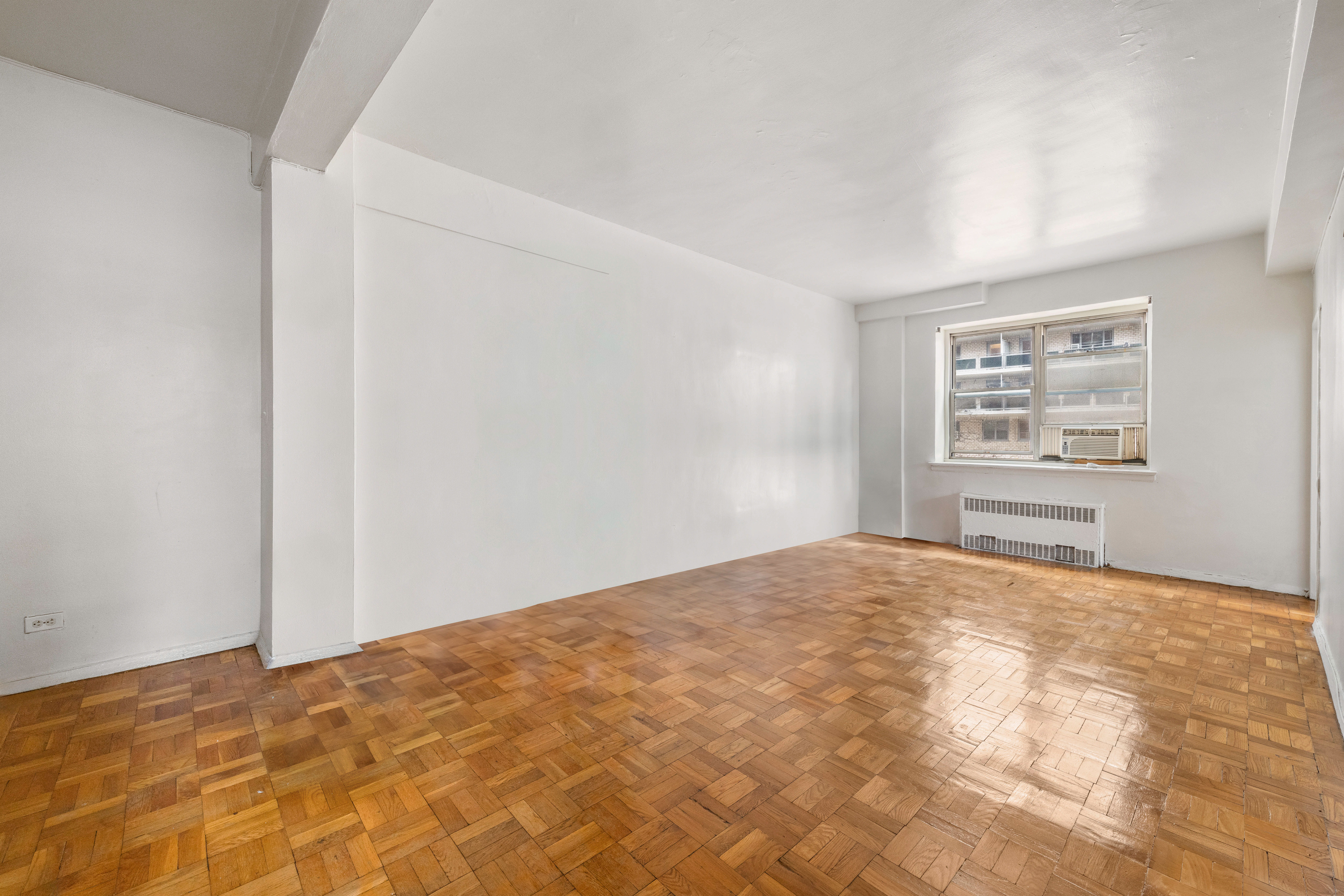 800 Grand Concourse, Unit GMS Bronx, NY 10451 - Photo 9 of 13 a view of an empty room and a window