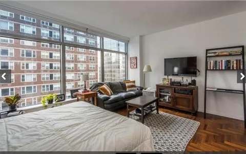 a bed room with a bed and a couch
