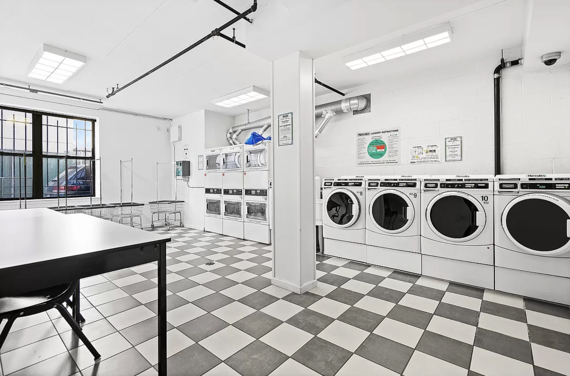 129 Boerum Place, Unit 5D Brooklyn, NY 11201 - Photo 7 of 9 a kitchen with a stove a refrigerator and a sink