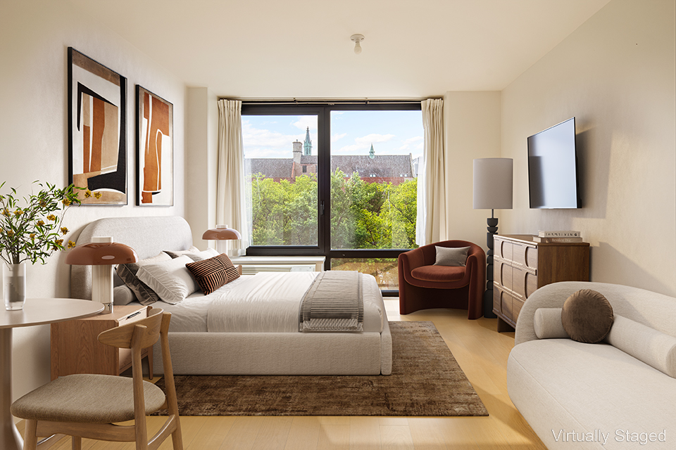 a living room with furniture or couch and a large window