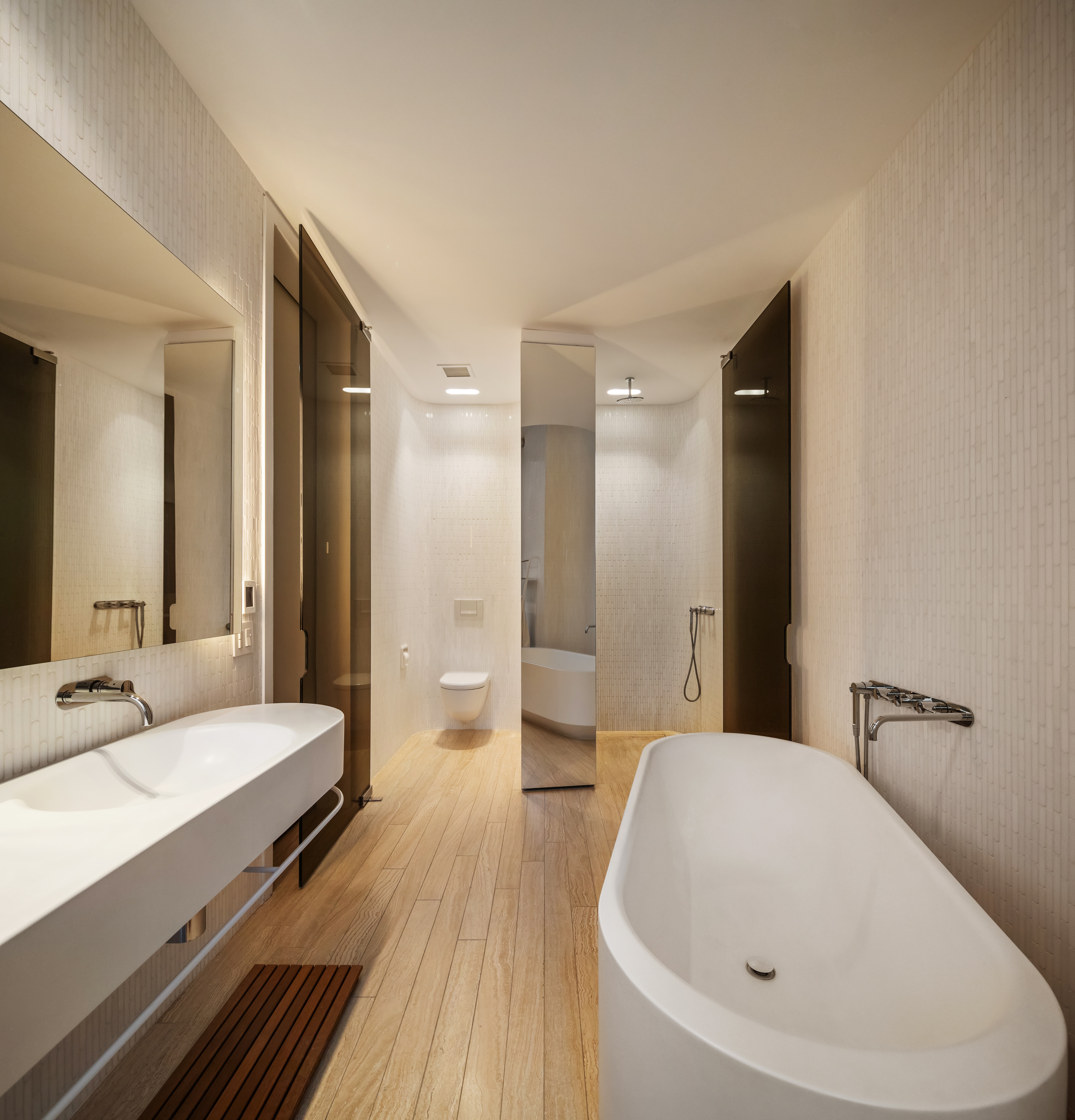 56 Leonard Street, Unit 21AWEST Manhattan, NY 10013 - Photo 6 of 11 a en suite bathroom with a double vanity sink and a large mirror