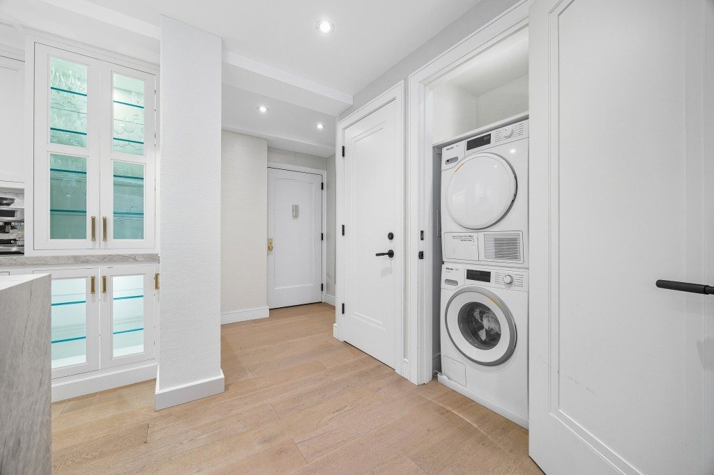 433 West 34th Street, Unit 4ABC Manhattan, NY 10001 - Photo 5 of 20 a view of a storage & utility room with washer and dryer